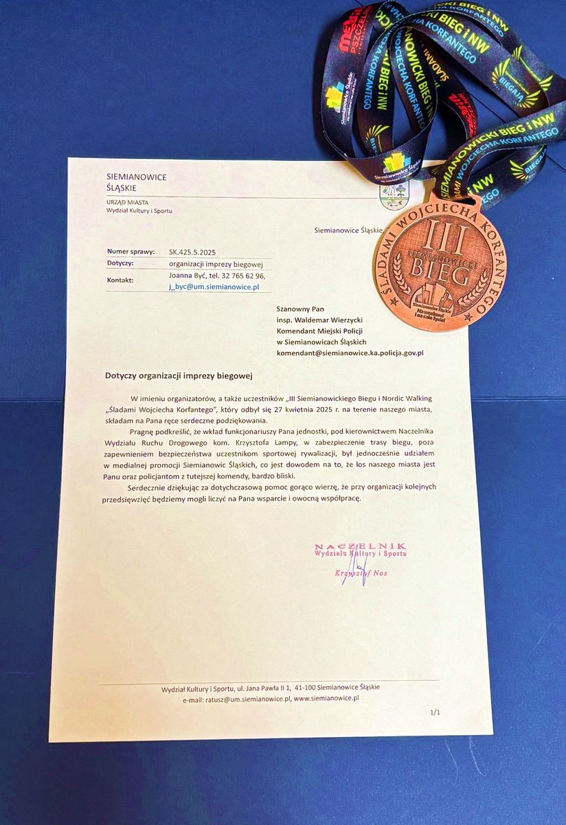 na zdjęciu podziękowania i medal