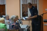 policjanci podczas spotkania z seniorami