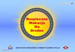 słońce i napis bezpieczne wakacje na drodze