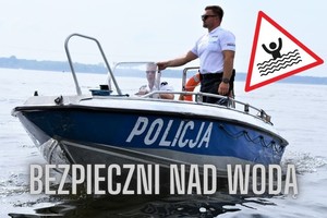 na zdjęciu policjant na motorówce i napis bezpieczni nad wodą