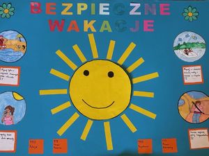 na zdjęciu praca plastyczna słońce i napis bezpieczne wakacje